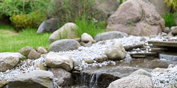river rocks are a nice added touch to gardening
